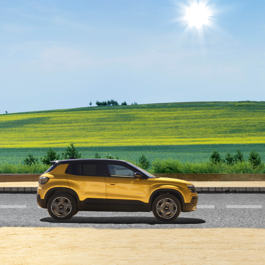 SUV compact Jeep performant en mouvement sur une route ensoleillée à la campagne